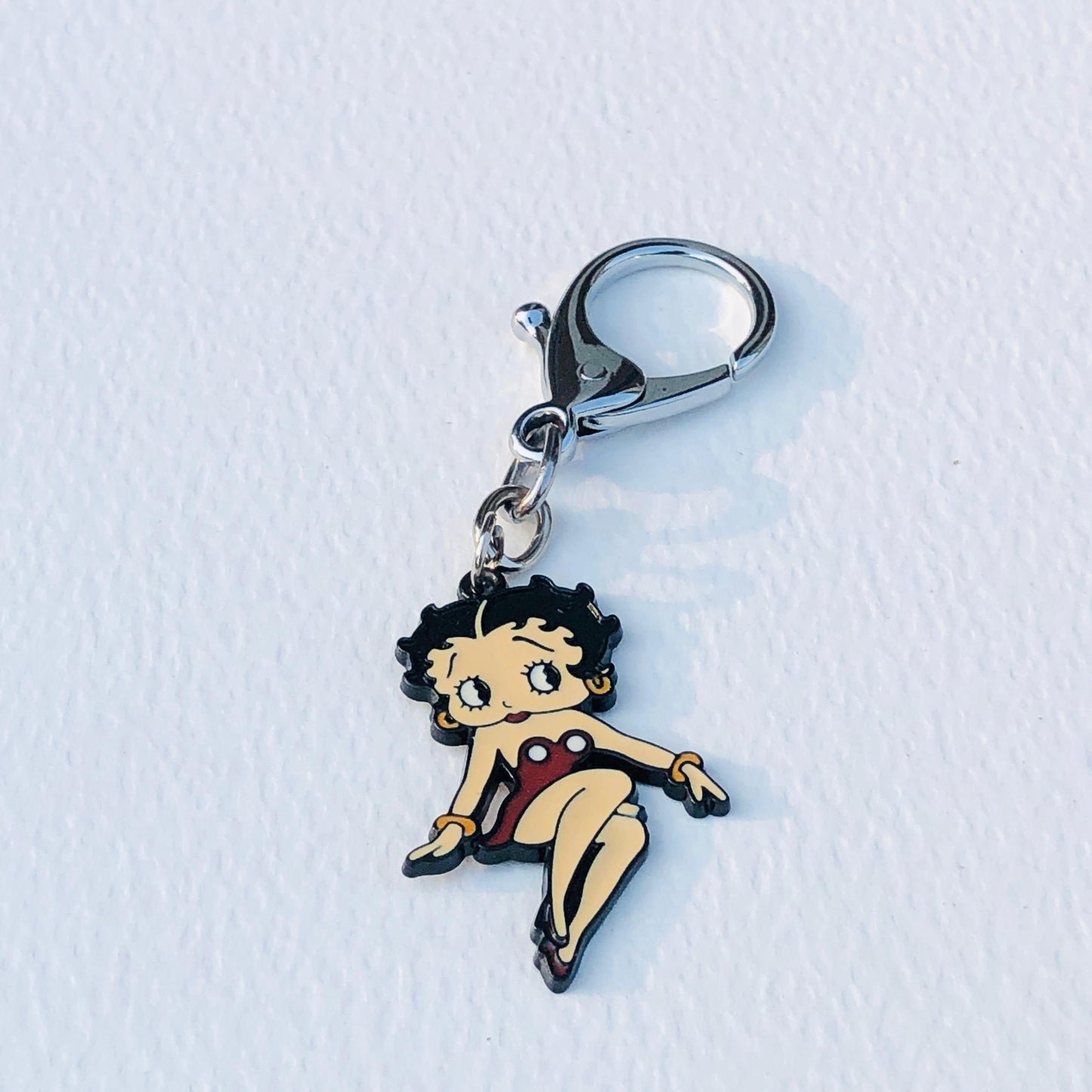 Keychain with cartoon character on a white surface