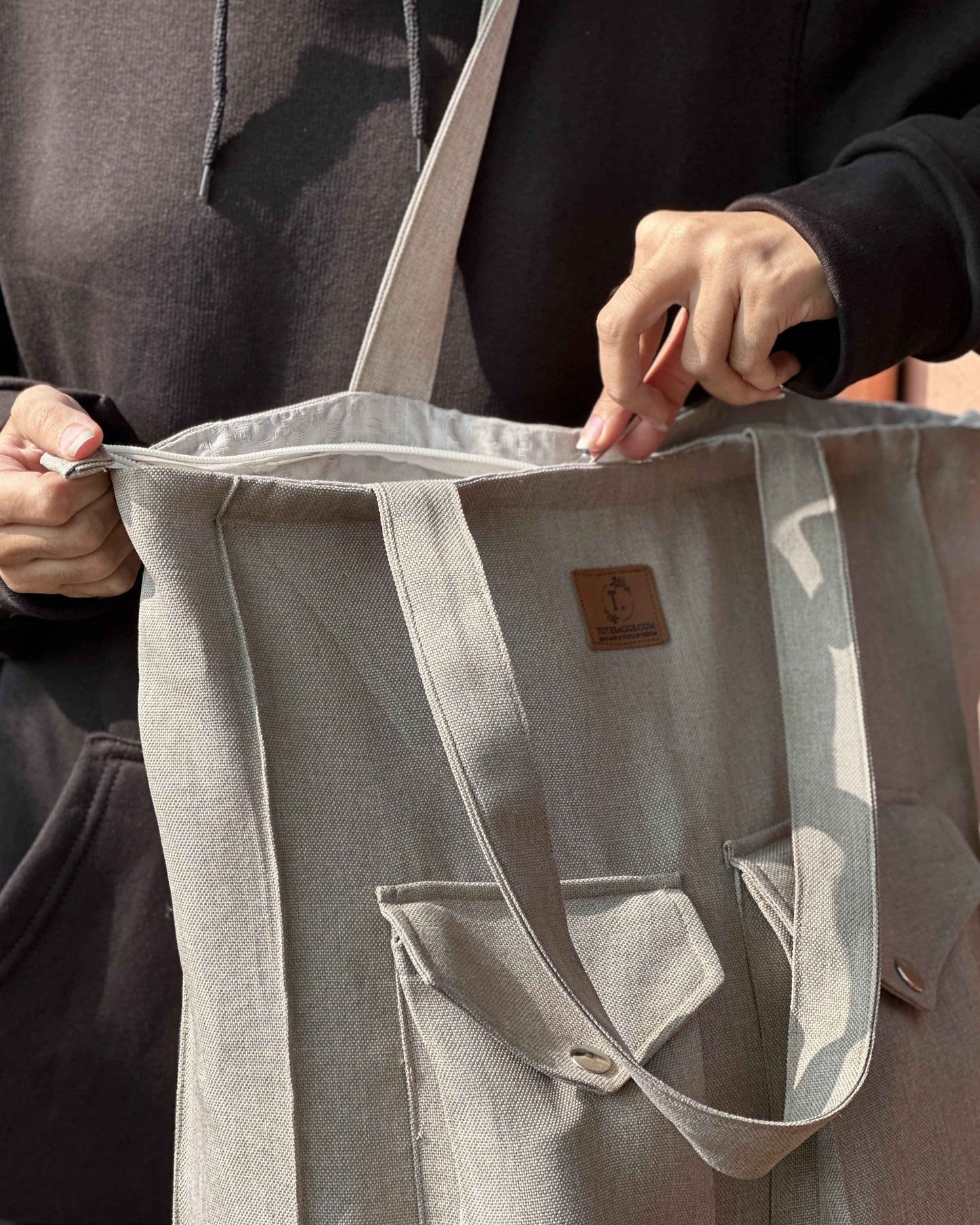 Canvas tote bag with zipper and two pockets available in black, navy, sand grey and maroon
