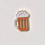 Beer mug-shaped pin on a light gray background