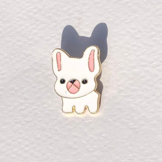 Cute cartoon dog pin on a textured white background